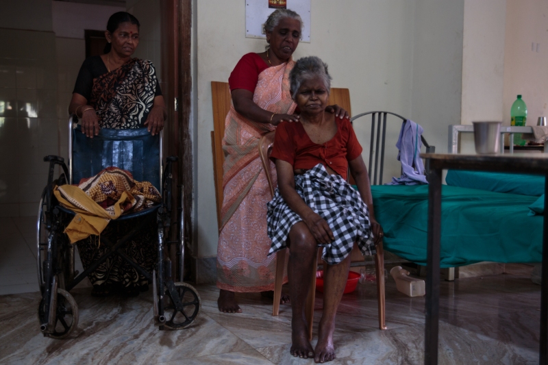 A patient sits in her room in the woman's ward waiting for treatment at the Ayurveda Hospital in the south of India, January 2013.