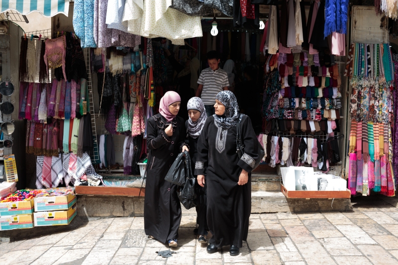 Muslim women walk the streets of the Old City in the Muslim Quarter on May 19, 2013.  